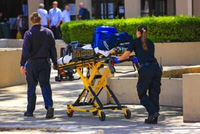 Paramedics pushing a gurny loaded with life saving equipment in Santa Barbara CA, USA Paramedics pushing a gurny loaded with life saving equipment in Santa Barbara CA, USA USE THIS ONE